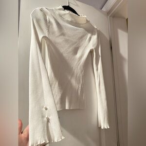 White ribbed, long sleeve top with pearl embellishments